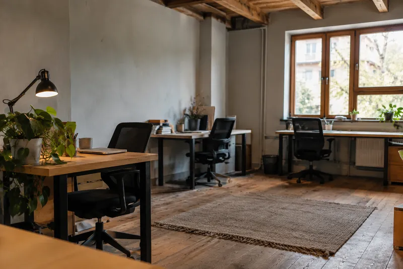 Generic coworking interior in a timber-ceiling studio